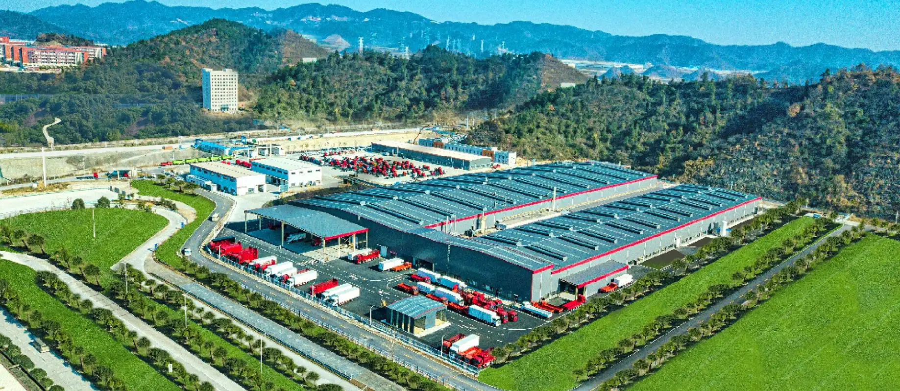 Dongfeng commercial vehicle export hub: a large fleet of heavy-duty trucks and vehicles prepared for international distribution and global logistics operations.