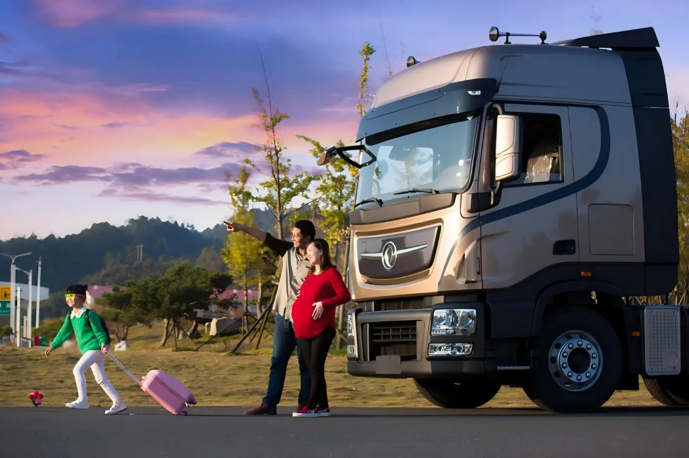 Family with modern heavy-duty truck at sunset, representing travel, logistics, and reliable transportation solutions.