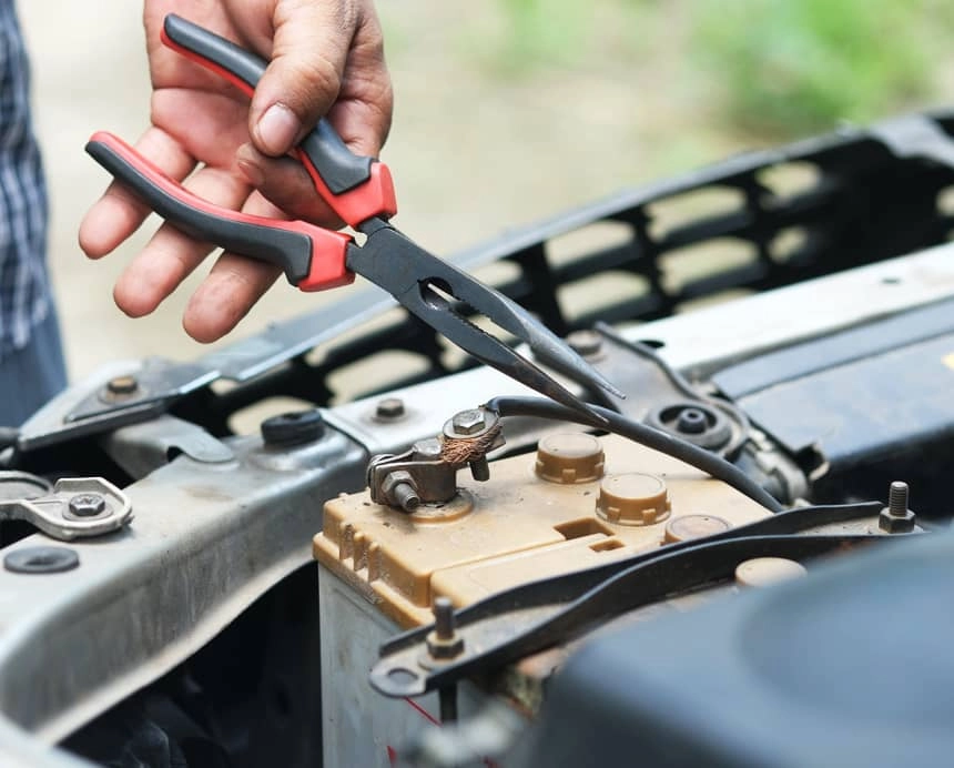 Skilled technician performing routine maintenance on commercial vehicle at service center, highlighting commitment to quality after-sales care.