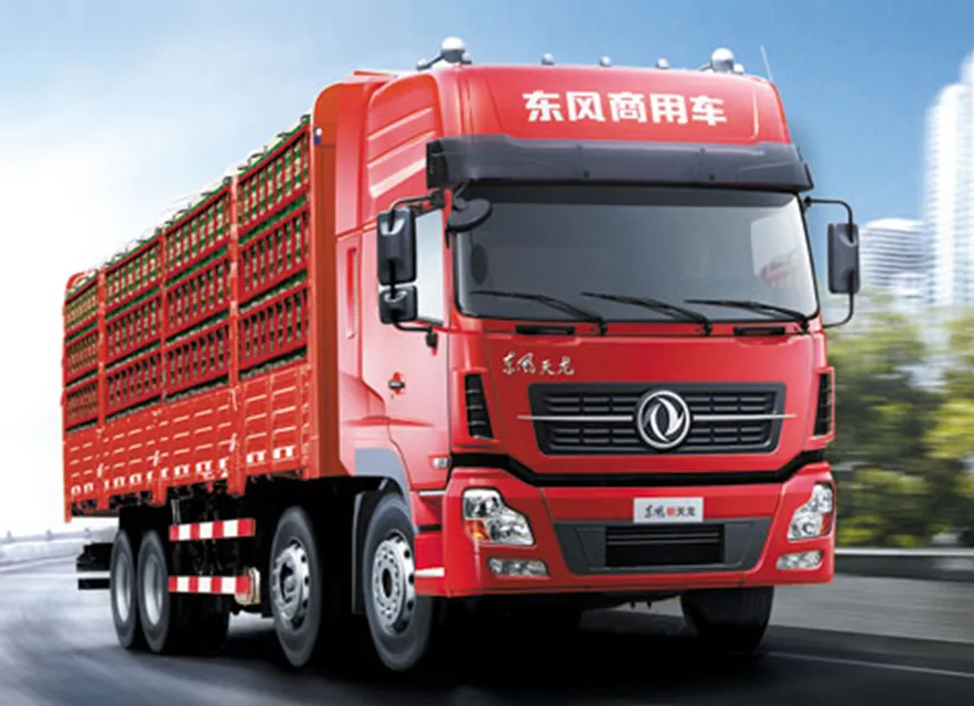 Red Dongfeng Tianlong heavy-duty stake body fence cargo truck, high-performance commercial vehicle for long-haul bulk goods, agricultural and livestock transportation worldwide.